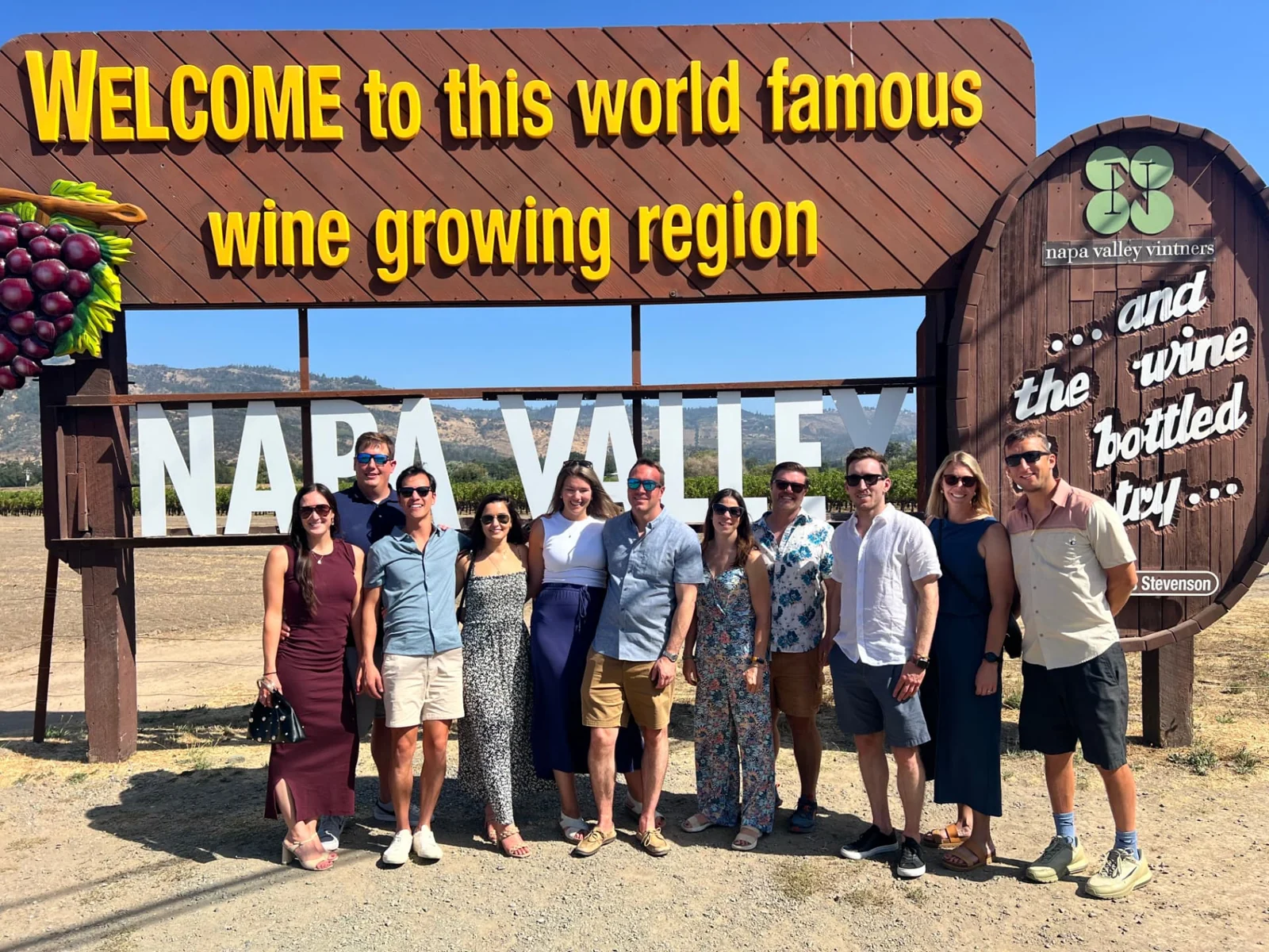 A group at the Napa Valley welcome sign.