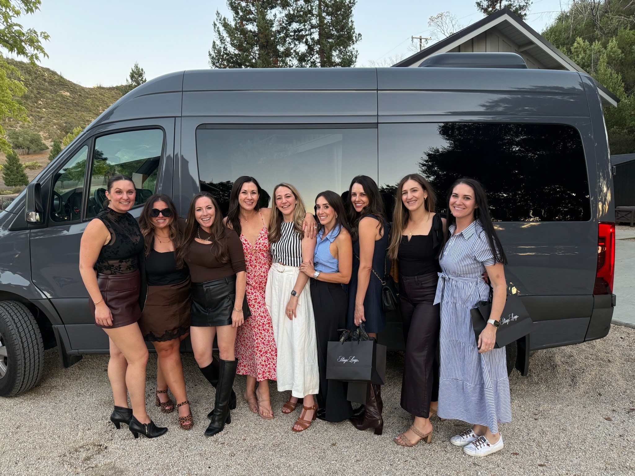 Large group enjoying wine tasting in Napa Valley with Ride Eaze designated driver service