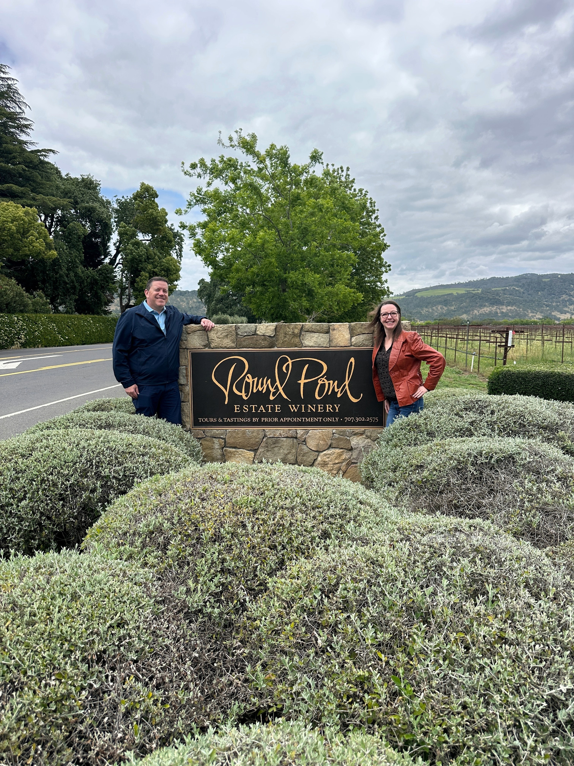 Couple enjoying a private Napa Valley wine tour at Round Pond Estate Winery with Ride Eaze.
