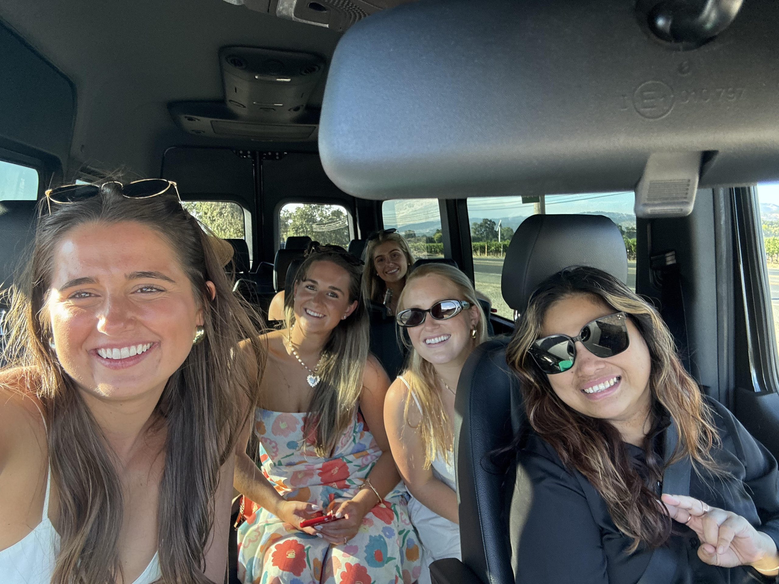 Group of wine tour guests with Ride Eaze in Napa Valley vineyards