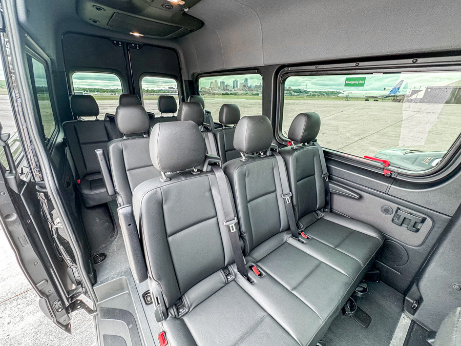 Mercedes Sprinter van passenger cabin with multiple rows of premium gray leather captain's chairs
