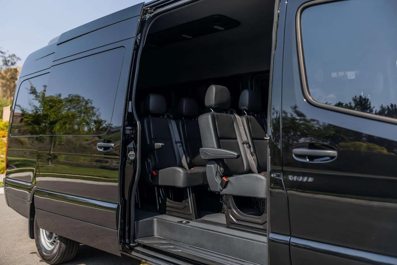 Mercedes Sprinter Van with door open showing luxury interior